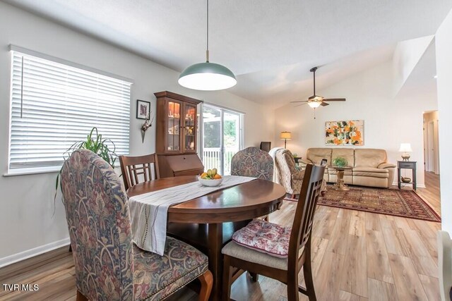 14227 Wellbridge Dr, Meadowview, VA 24361 - dining area featuring a ceiling fan, wood finished floors, lofted ceiling, and baseboards