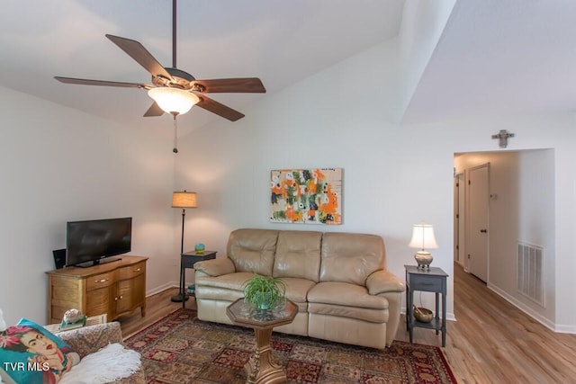 14227 Wellbridge Dr, Meadowview, VA 24361 - living room featuring wood finished floors, a ceiling fan, baseboards, and high vaulted ceiling
