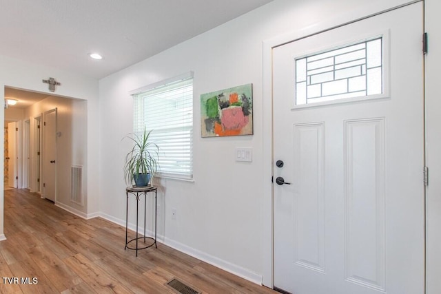 14227 Wellbridge Dr, Meadowview, VA 24361 - foyer entrance featuring healthy amount of natural light, light wood-type flooring, baseboards, and recessed lighting