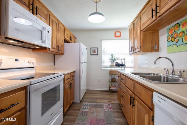 14227 Wellbridge Dr, Meadowview, VA 24361 - kitchen with white appliances, a sink, and brown cabinets