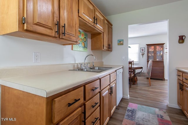 14227 Wellbridge Dr, Meadowview, VA 24361 - kitchen featuring a sink, dishwasher, wood finished floors, light countertops, and brown cabinets