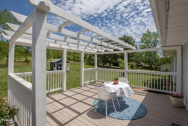 14227 Wellbridge Dr, Meadowview, VA 24361 - wooden terrace featuring a pergola, a lawn, and an outbuilding