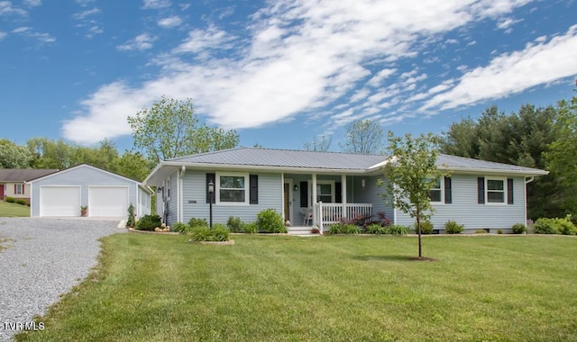 14227 Wellbridge Dr, Meadowview, VA 24361 - ranch-style home with a porch, an outbuilding, a garage, metal roof, and a front yard