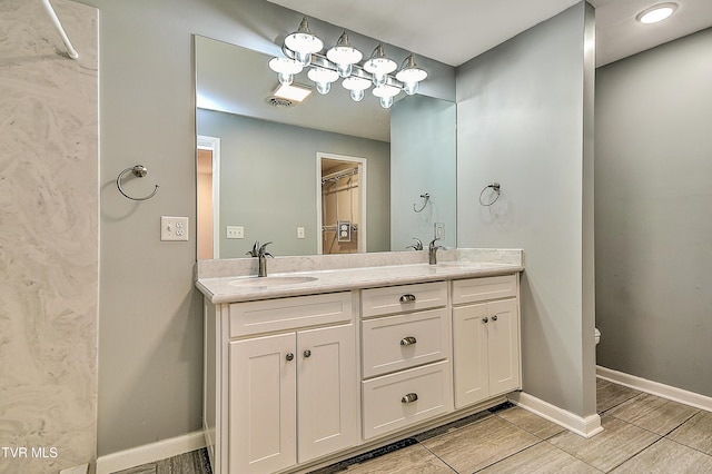 28 Kingsbridge St, Bristol, TN 37620 - bathroom with double vanity, baseboards, and toilet