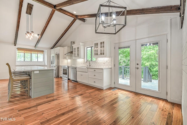 28 Kingsbridge St, Bristol, TN 37620 - kitchen featuring a chandelier, stainless steel appliances, a breakfast bar area, light countertops, and beamed ceiling