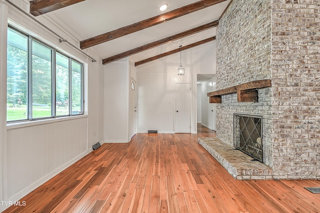 28 Kingsbridge St, Bristol, TN 37620 - unfurnished living room featuring hardwood / wood-style floors, a brick fireplace, and baseboards