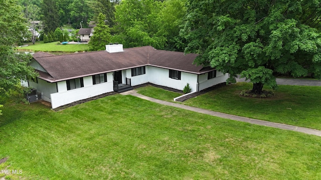 28 Kingsbridge St, Bristol, TN 37620 - view of front of property with a shingled roof, a front lawn, a chimney, and driveway