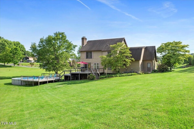 124 Highland Hills Dr, Gray, TN 37615 - rear view of property with a deck, a chimney, a lawn, and a shingled roof