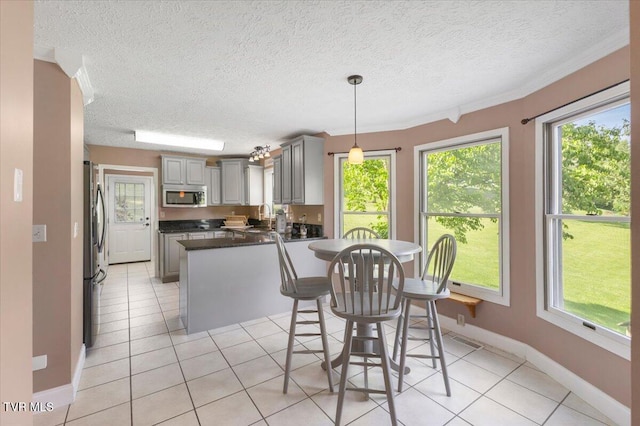 124 Highland Hills Dr, Gray, TN 37615 - dining space featuring plenty of natural light, light tile patterned floors, baseboards, and a textured ceiling