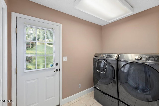 124 Highland Hills Dr, Gray, TN 37615 - laundry room with washing machine and clothes dryer, baseboards, and light tile patterned floors