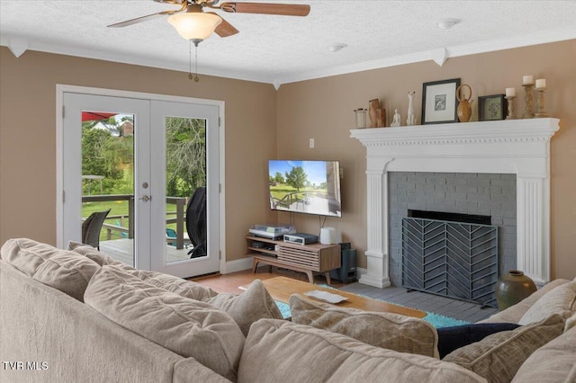 124 Highland Hills Dr, Gray, TN 37615 - living area with ceiling fan, crown molding, french doors, a textured ceiling, and wood finished floors