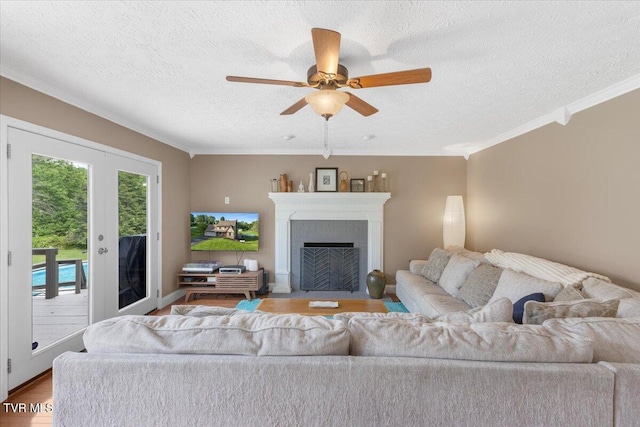 124 Highland Hills Dr, Gray, TN 37615 - living area featuring ornamental molding, a textured ceiling, ceiling fan, wood finished floors, and a fireplace with flush hearth
