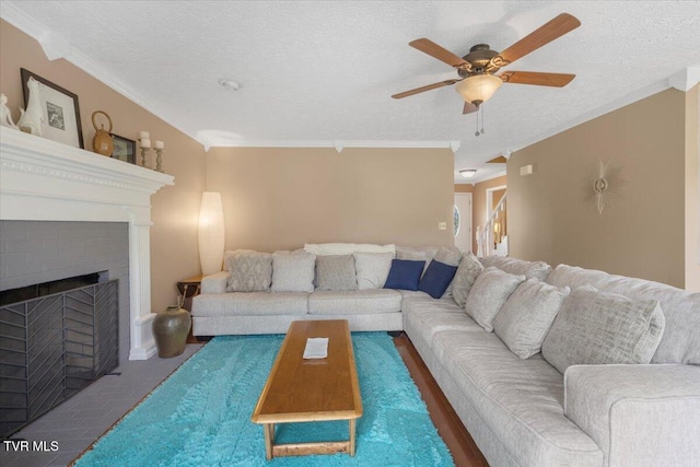 124 Highland Hills Dr, Gray, TN 37615 - living area with ceiling fan, a textured ceiling, crown molding, and a brick fireplace