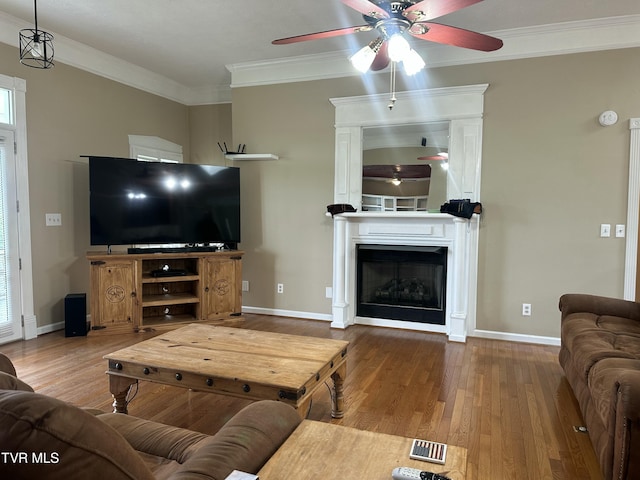 390 Springdale Dr, Bristol, TN 37620 - living area with ceiling fan, wood finished floors, ornamental molding, and baseboards