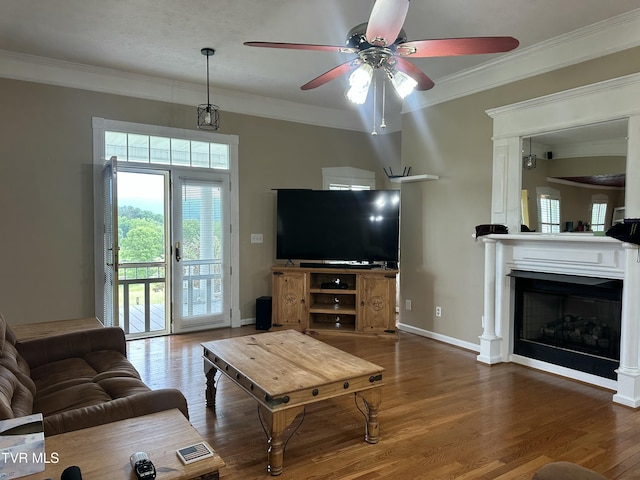 390 Springdale Dr, Bristol, TN 37620 - living area featuring ceiling fan, wood finished floors, ornamental molding, baseboards, and a fireplace