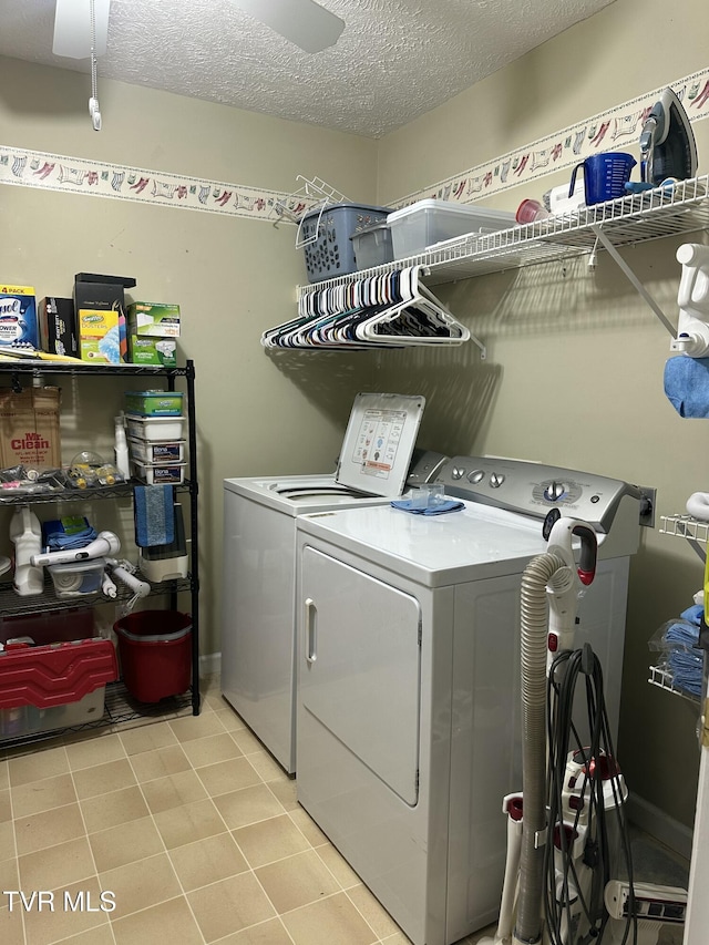 390 Springdale Dr, Bristol, TN 37620 - washroom with separate washer and dryer and a textured ceiling