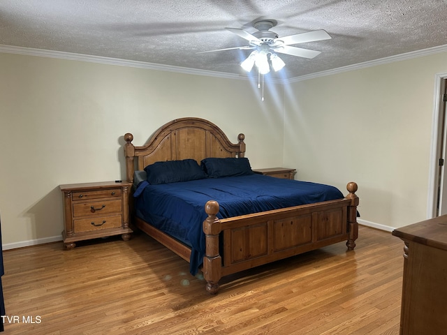 390 Springdale Dr, Bristol, TN 37620 - bedroom with a textured ceiling, light wood finished floors, crown molding, baseboards, and a ceiling fan