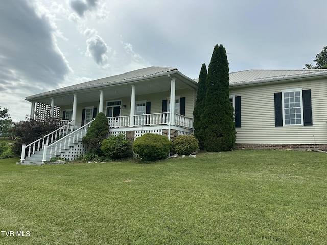 390 Springdale Dr, Bristol, TN 37620 - view of front facade featuring covered porch, a front yard, and metal roof