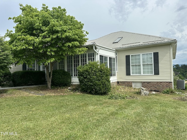 390 Springdale Dr, Bristol, TN 37620 - view of side of property featuring central AC, a yard, and metal roof