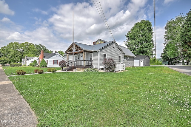 1401 Burgie St, Elizabethton, TN 37643 - view of front of home with a front lawn, metal roof, and a detached garage