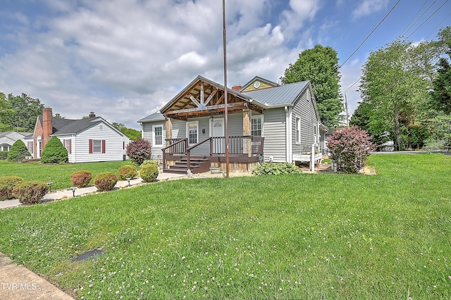 1401 Burgie St, Elizabethton, TN 37643 - view of front of house featuring covered porch, a front yard, and metal roof