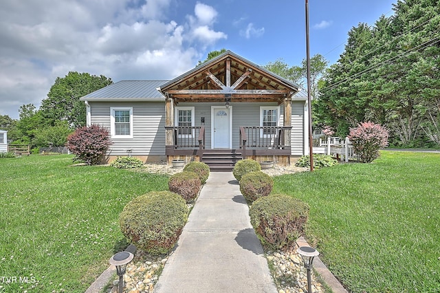 1401 Burgie St, Elizabethton, TN 37643 - bungalow-style home featuring covered porch, a front yard, and metal roof