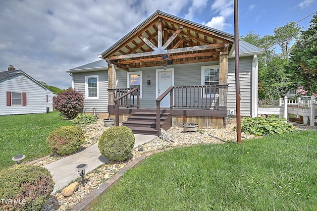 1401 Burgie St, Elizabethton, TN 37643 - view of front of property featuring a front lawn, a porch, and metal roof