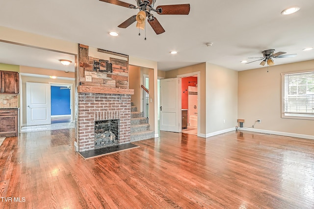 1401 Burgie St, Elizabethton, TN 37643 - unfurnished living room featuring a ceiling fan, light wood finished floors, baseboards, a fireplace, and recessed lighting