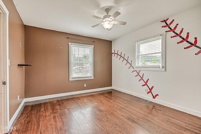 1401 Burgie St, Elizabethton, TN 37643 - unfurnished room with wood finished floors, a ceiling fan, and baseboards