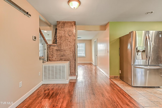 1401 Burgie St, Elizabethton, TN 37643 - unfurnished living room with wood finished floors, baseboards, and stairway