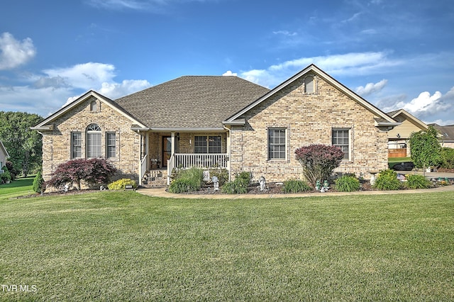 105 Morse Dr, Bristol, TN 37620 - view of front facade with a porch, brick siding, a front yard, and roof with shingles