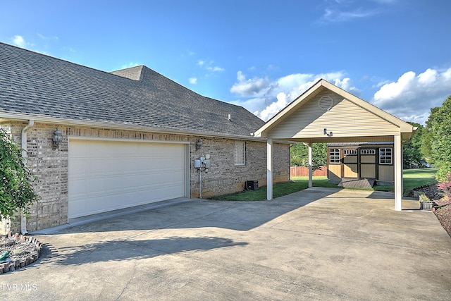 105 Morse Dr, Bristol, TN 37620 - view of side of property with brick siding, roof with shingles, driveway, and a garage