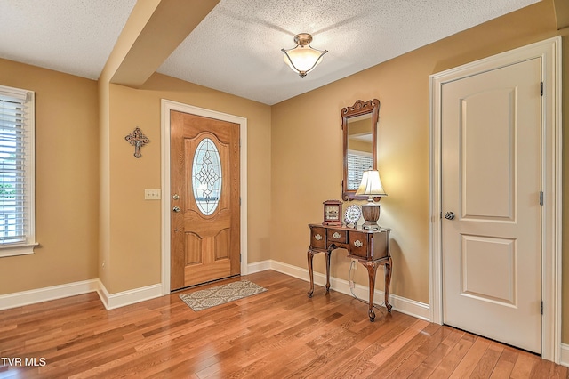 105 Morse Dr, Bristol, TN 37620 - entryway featuring a textured ceiling, light wood-style flooring, and baseboards