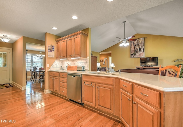 105 Morse Dr, Bristol, TN 37620 - kitchen featuring stainless steel dishwasher, a sink, ceiling fan, a peninsula, and light wood-style flooring