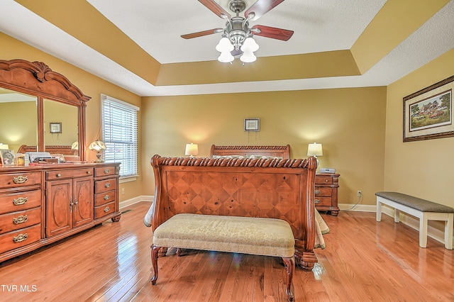 105 Morse Dr, Bristol, TN 37620 - bedroom with a raised ceiling, baseboards, light wood-style floors, and a ceiling fan