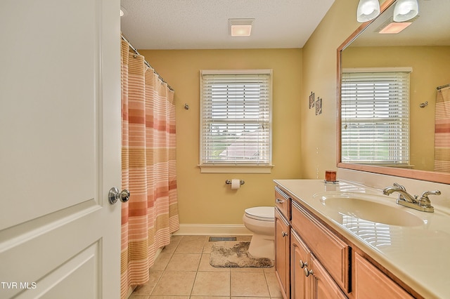 105 Morse Dr, Bristol, TN 37620 - bathroom featuring plenty of natural light, tile patterned flooring, vanity, and toilet
