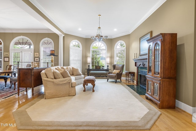 21390 Sheffield Ct, Abingdon, VA 24210 - living room with a premium fireplace, a chandelier, light wood finished floors, crown molding, and recessed lighting