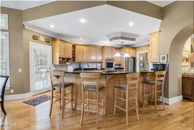 21390 Sheffield Ct, Abingdon, VA 24210 - kitchen featuring appliances with stainless steel finishes, arched walkways, open shelves, crown molding, and light wood-style floors