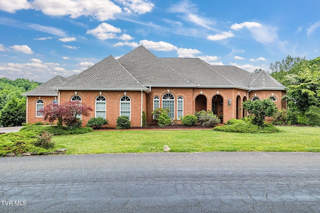 21390 Sheffield Ct, Abingdon, VA 24210 - view of front of property with brick siding, a front yard, and a shingled roof
