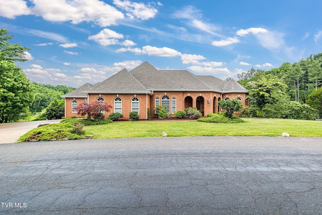 21390 Sheffield Ct, Abingdon, VA 24210 - view of front of property with a front lawn, brick siding, and a shingled roof