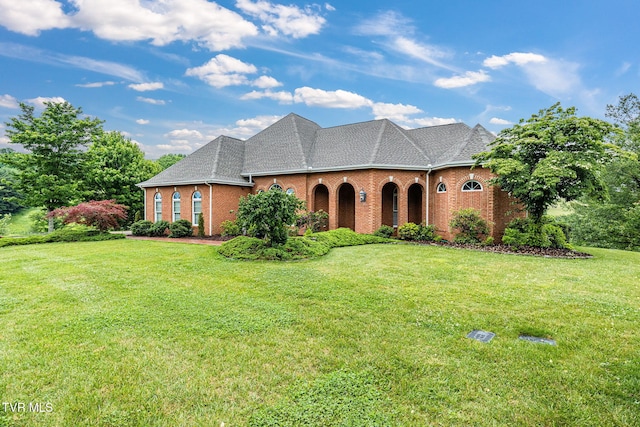 21390 Sheffield Ct, Abingdon, VA 24210 - view of front of home with brick siding, a front lawn, and roof with shingles
