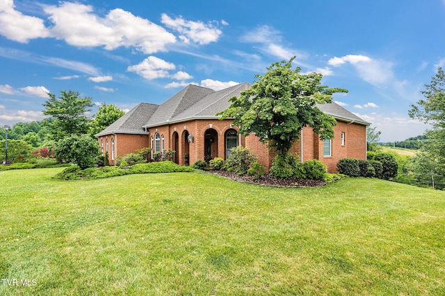 21390 Sheffield Ct, Abingdon, VA 24210 - french country home featuring brick siding, a front yard, and roof with shingles