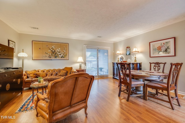 1016 Konnarock Rd # 1, Kingsport, TN 37664 - living area with light wood-style flooring, crown molding, a textured ceiling, and baseboards