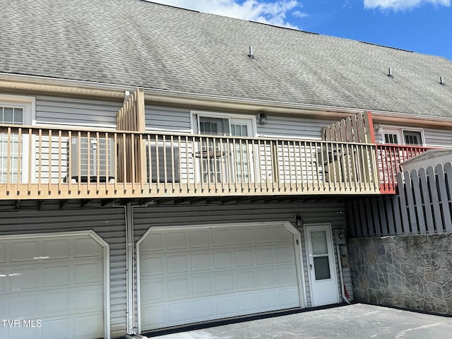 210 Spring St Unit C3, Blountville, TN 37617 - rear view of house with a balcony, a garage, and roof with shingles