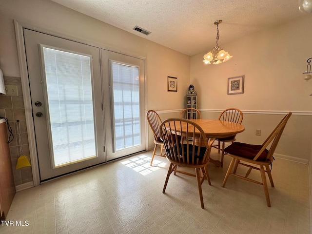 210 Spring St Unit C3, Blountville, TN 37617 - dining area featuring a chandelier and a textured ceiling