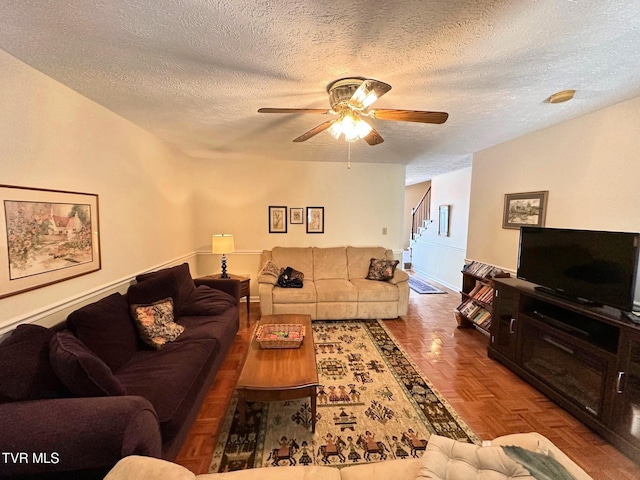 210 Spring St Unit C3, Blountville, TN 37617 - living room with a ceiling fan, a textured ceiling, and stairway