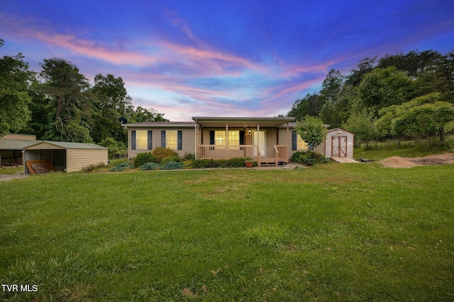 108 Richards Rd, Rogersville, TN 37857 - ranch-style home with a porch, a lawn, and a carport