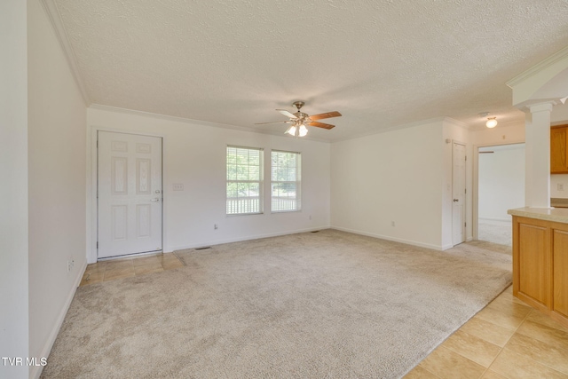 108 Richards Rd, Rogersville, TN 37857 - unfurnished living room with a textured ceiling, a ceiling fan, light colored carpet, crown molding, and ornate columns