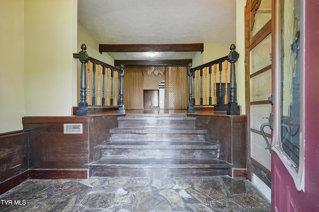 11316 Boggs Hollow Rd, Pound, VA 24279 - staircase with stone floors and beam ceiling