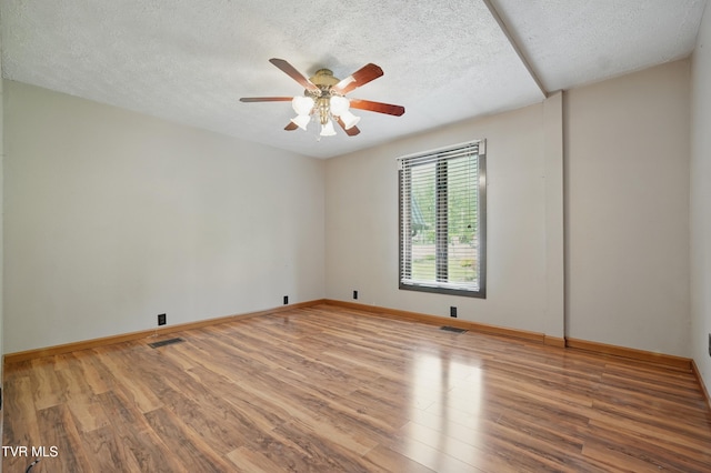 11316 Boggs Hollow Rd, Pound, VA 24279 - unfurnished room featuring wood finished floors, a ceiling fan, a textured ceiling, and baseboards